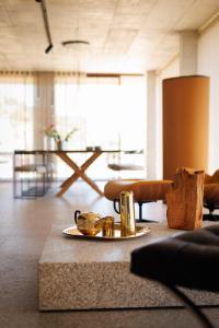 a living room with a table with a tray of food at BONELLI HOUSE in Alijó