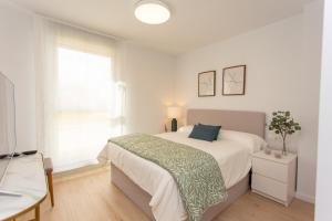 Posteľ alebo postele v izbe v ubytovaní Denia apartment Marina