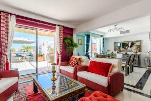 a living room with couches and a table at Marina Real - Sea View by HD PROPERTIES in Vilamoura