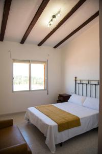 Un pat sau paturi într-o cameră la La Casa del Monte