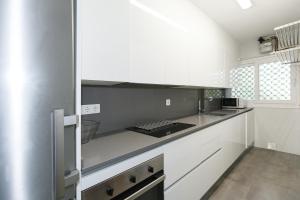 Kuchyň nebo kuchyňský kout v ubytování UHC Scala Mar Apartments