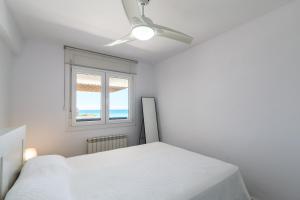 Postel nebo postele na pokoji v ubytování UHC Scala Mar Apartments