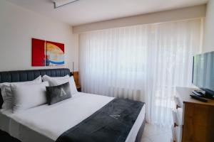 Ένα ή περισσότερα κρεβάτια σε δωμάτιο στο ALEXANDRA Boutique Residence Seaside