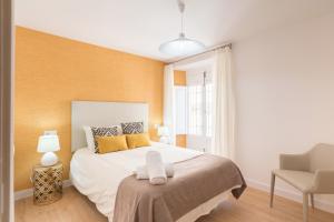 Łóżko lub łóżka w pokoju w obiekcie Merced10 3E