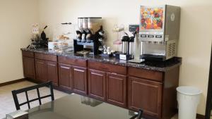a kitchen with a counter with a coffee maker on it at Horizon Inn in Lincoln