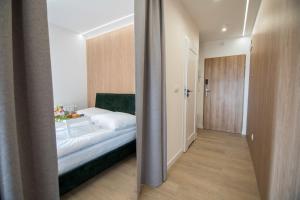 Posteľ alebo postele v izbe v ubytovaní Z Widokiem Apartamenty Świerkowe 13
