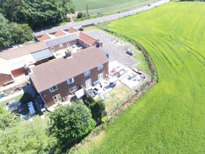 an aerial view of a house with a field at The Feed Room At Eastmoor Farm Fully Renovated Fully Equipped 2 Bed Luxury Mews Cottage 1 Mile from the Beach in Bridlington
