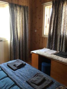 Postel nebo postele na pokoji v ubytování Pervolaris Cottages 1