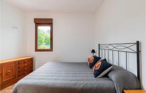 A bed or beds in a room at 3 Bedroom Nice Apartment In A Arnoia