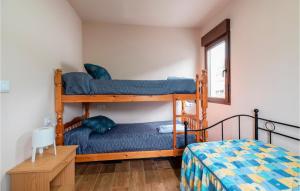 A bed or beds in a room at 3 Bedroom Nice Apartment In A Arnoia