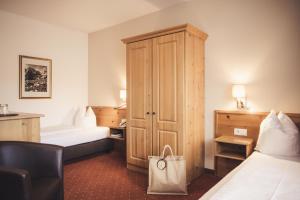 Postel nebo postele na pokoji v ubytování Hotel Johanna mitten im Ötztal