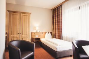 Postel nebo postele na pokoji v ubytování Hotel Johanna mitten im Ötztal