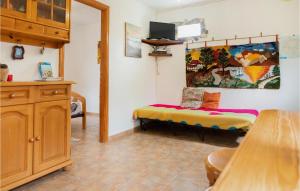A television and/or entertainment centre at 1 Bedroom Nice Home In Vallehermoso