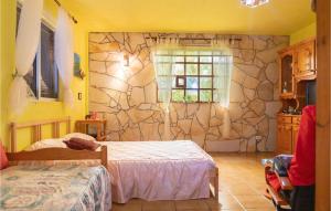 A bed or beds in a room at 1 Bedroom Nice Home In Vallehermoso
