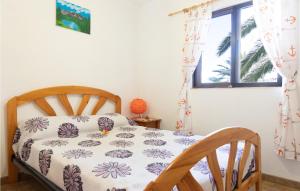 A bed or beds in a room at 1 Bedroom Nice Home In Vallehermoso