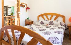 A bed or beds in a room at 1 Bedroom Nice Home In Vallehermoso