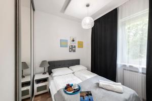 Posteľ alebo postele v izbe v ubytovaní ShortStayPoland Wybrzeże Kościuszkowskie (B24)