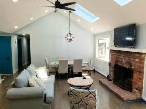 a living room with a couch and a fireplace at CAPE COD'S BEST BEACH GETAWAY in Falmouth