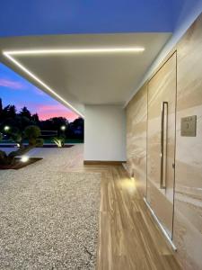a large room with a view of a sunset at VISTA LAGO VILLE in Chiclana de la Frontera