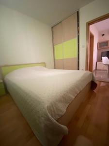 Postel nebo postele na pokoji v ubytování Apartmani IvaMia