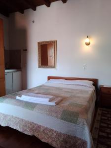 Posteľ alebo postele v izbe v ubytovaní Arka Metsovo