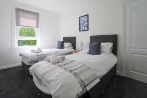Postel nebo postele na pokoji v ubytování The Cove Apartment + 5 fotografií