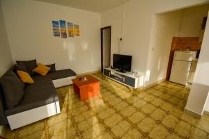 TV a/nebo společenská místnost v ubytování Bungalow Olivtree