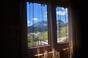 a window with a view of a mountain at Durmitor view in Žabljak