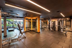 a gym with treadmills and cardio equipment in a building at Genesis Hotel&Spa Alaçatı in Alaçatı