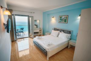 A bed or beds in a room at Ionion Beach Resort
