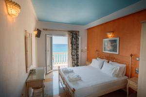 A bed or beds in a room at Ionion Beach Resort