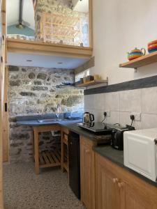 a kitchen with a sink and a counter top at The Rowe House in Horton in Ribblesdale