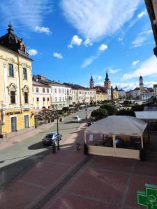 a white tent on a city street with buildings at Apartman u Klavdie in Banská Bystrica