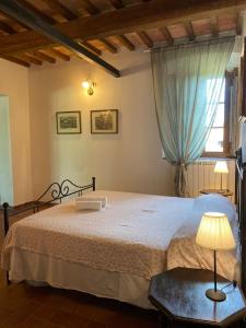מיטה או מיטות בחדר ב-Agriturismo I Moricci