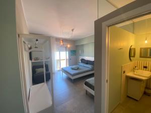 TV a/nebo společenská místnost v ubytování Oltremare Rooms Vasto + 39 fotografií