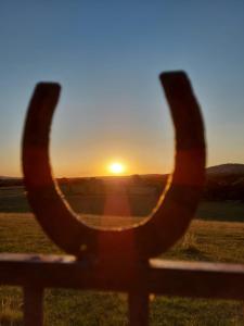 The sunrise or sunset as seen from a panziókat or nearby