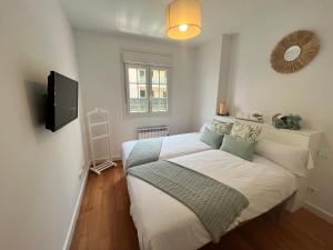 Posteľ alebo postele v izbe v ubytovaní Apartamento con terraza y acceso a la playa