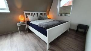 En eller flere senge i et værelse på Ferienhaus Sielperle
