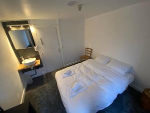 Letto o letti in una camera di RestAuberge La Reine Meije