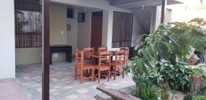 a wooden table and chairs on a patio at Tilcafé B&B Mollepata in Mollepata