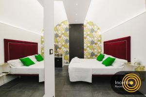 Postel nebo postele na pokoji v ubytování Incentro Rooms