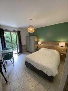 Katil atau katil-katil dalam bilik di Hotel de la Jonte