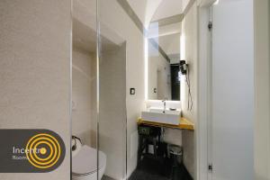 Koupelna v ubytování Incentro Rooms