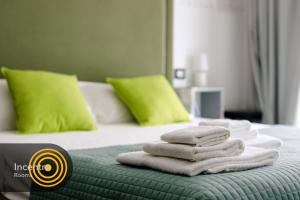 Postel nebo postele na pokoji v ubytování Incentro Rooms