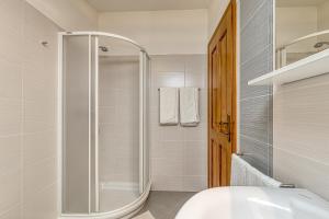 a bathroom with a shower and a toilet and a sink at La Quiete B&B in Lovrečica