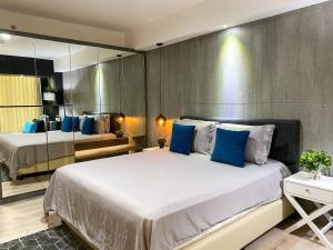 Postelja oz. postelje v sobi nastanitve Lavenderbnb Room 8 at Mataram City