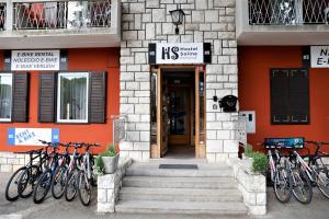 a group of bikes parked outside of a building at Hostel Soline in Portorož