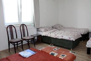 Posteľ alebo postele v izbe v ubytovaní Dusan Apartments + 8 fotografií