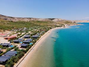 an aerial view of a beach with houses and the ocean at Terra Park SpiritoS in Kolan