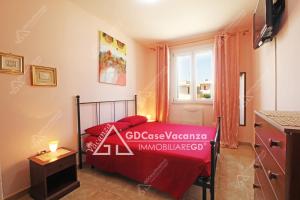 a small bedroom with a bed and a window at GD Case Vacanza - Fronte Mare - in Lido Marini